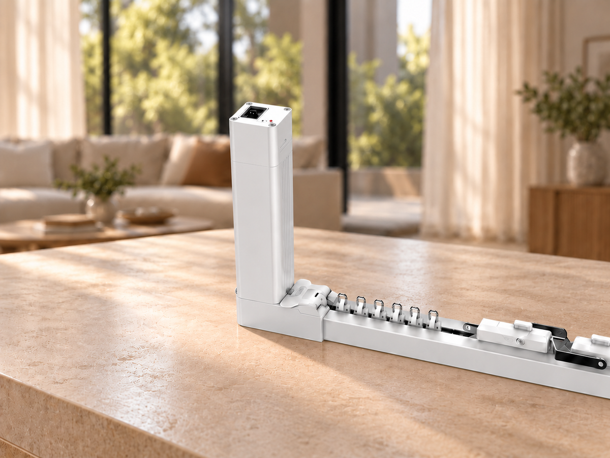 Illustrative close-up of an Arklyfe 87E curtain motor and track on a stone console in a softly lit living room.